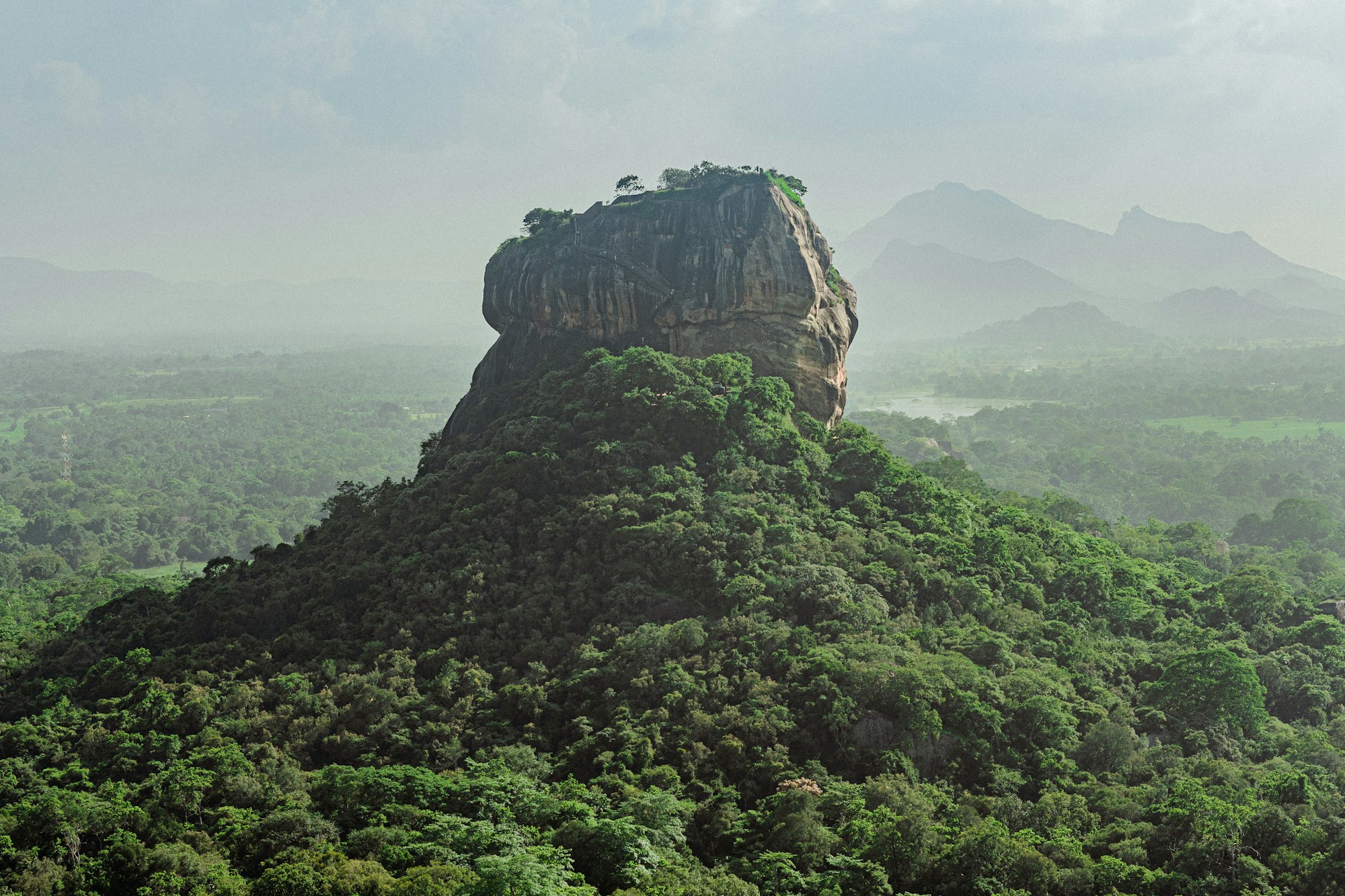 Sigiriya rock rising above Sri Lanka’s green forests